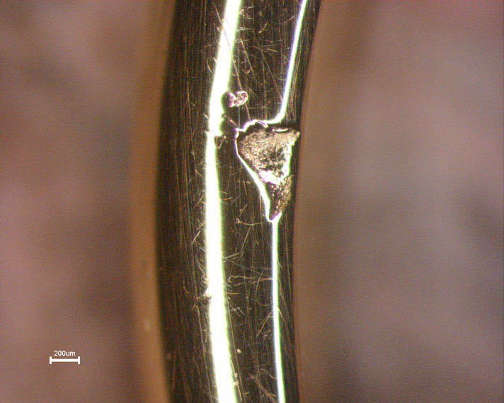 Surface irregularity caused by investment inclusions